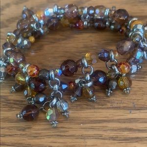 Brown yellow and orange bracelet with dangles